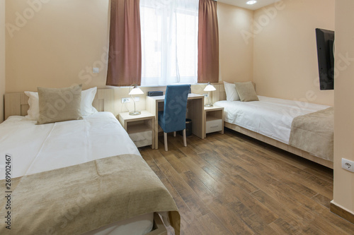 Hotel room interior, beige bedroom