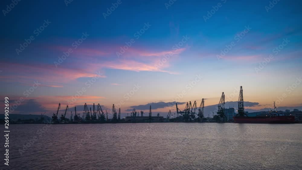 Sunset ovet industrial cranes and cargo ships in port Varna, Bulgaria Sunset ovet industrial cranes and cargo ships in port Varna, Bulgaria