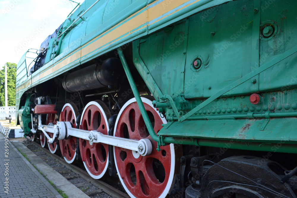 Naklejka premium The wheels of an old steam locomotive.