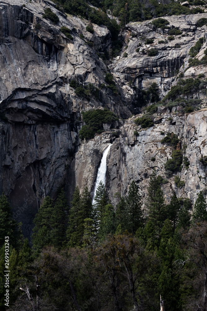 Distant View Of Waterfall Yosemite Park With Trees