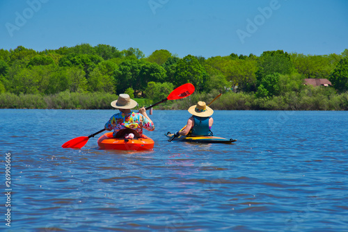 Kayaks on a Lake.