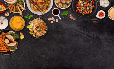 Asian food background with various ingredients on rustic stone background , top view. Vietnam and Thai cuisine.