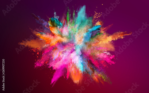 Colored powder explosion on dark gradient background. Freeze motion.