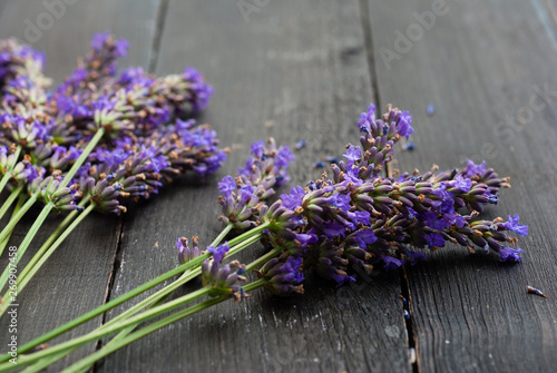 Fototapeta Naklejka Na Ścianę i Meble -  purple lavender flowers on black wooden table background