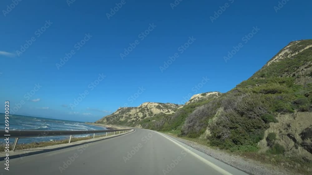 car rides along the road along the sea and mountains, view from the car car rides along the road along the sea and mountains, view from the car
