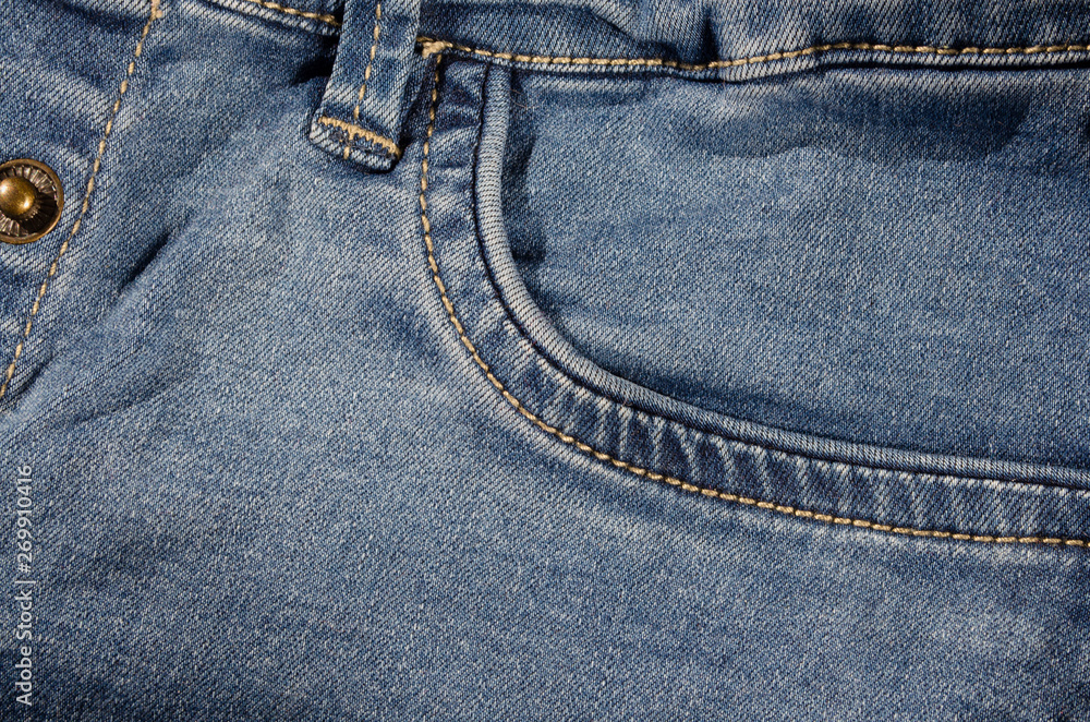 Blue jeans detail with empty pocket