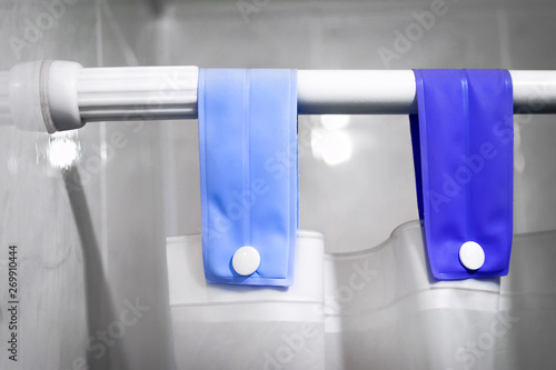 Shower Curtain Rod, Blue Fabric Loops, White Buttons and Shower Curtain.