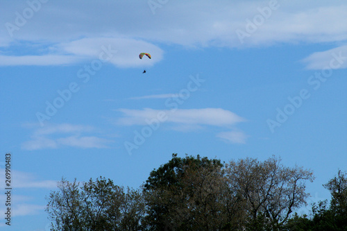 paragliding in the sky,motorized,parachute, blue, sport, fly, paraglider,adventure, gliding, sports, cloud,activity, wind, high, 