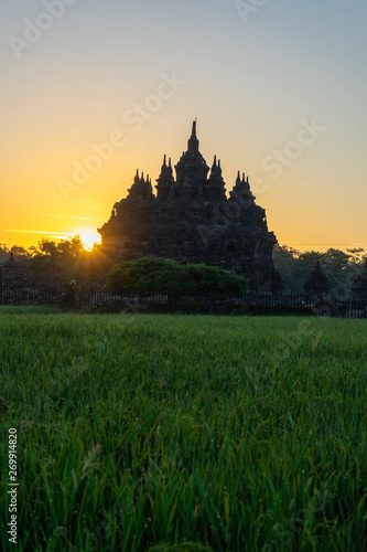 the view of the sunrise in a village with a plaosan buddhist temple background in Yogyakarta, Indonesia
