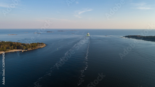 Aerial panorama of modern ferry depart from port of Helsinki to Tallinn at sunset. Travelling in baltic sea. 