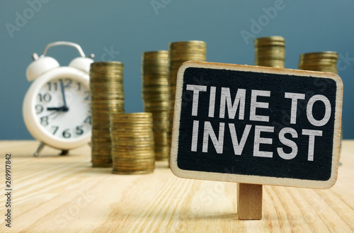 Wallpaper Mural Time to invest concept. Stacks of coins and alarm clock. Torontodigital.ca