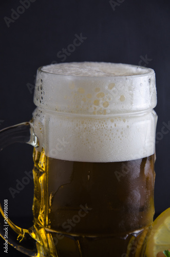 beer foam in to on a black background, selective focus
