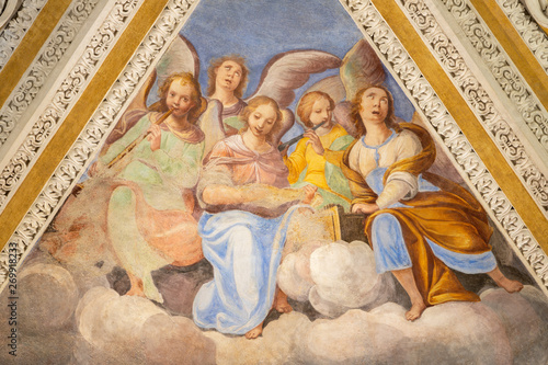 OSSUCCIO, ITALY - MAY 8, 2015: The baroque fresco choir of angels with the music instruments in church Sacro Monte della Beata Vergine del Soccorso by Salvatore Pozzi di Puria  (1595 – 1681). photo