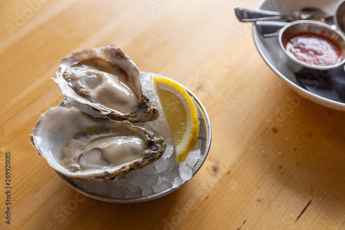 Two Oysters bowl w condiments photo