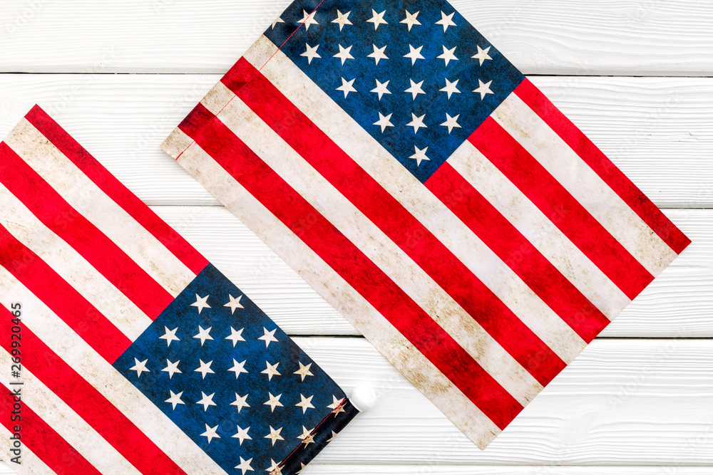 Independence day of USA with flag on white wooden background top view