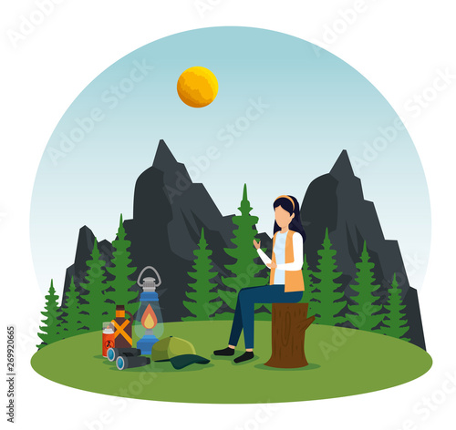 woman sitting in the tree trunk with lamp and repellent