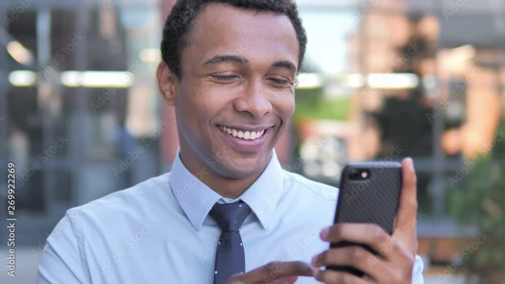 Wow, African Businessman Surprised on Smartphone Wow, African Businessman Surprised on Smartphone