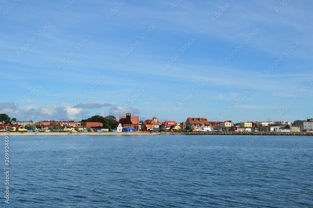 Hel, Poland. View from the sea on the town, beach and breakwater. Sunny day on Hel Peninsula