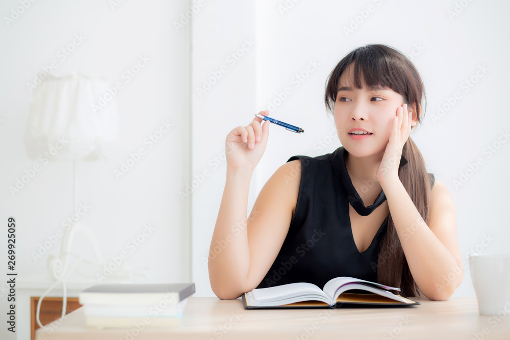Beautiful asian woman writer thinking idea and writing on notebook or diary with happy on desk office, lifestyle of asia girl is success, female planning working, education and business concept. Beautiful asian woman writer thinking idea and writing on notebook or diary with happy on desk office, lifestyle of asia girl is success, female planning working, education and business concept.