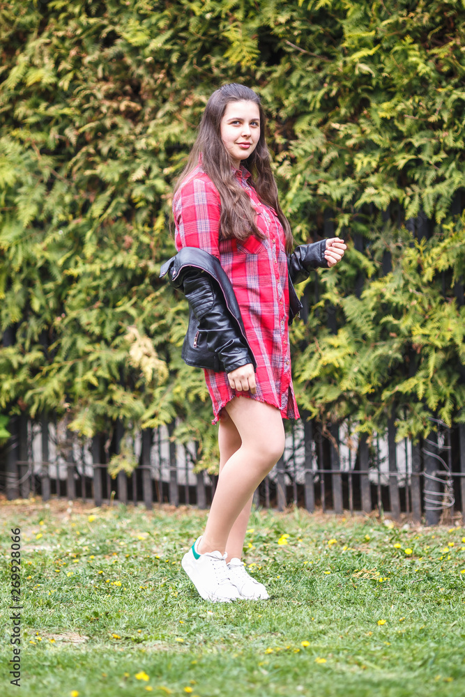 close up portrait of beautiful stylish plus size model kid girl in plaid shirt and leather jacket close up portrait of beautiful stylish plus size model kid girl in plaid shirt and leather jacket