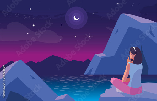 Fotografie woman seated observing nightscape with lake