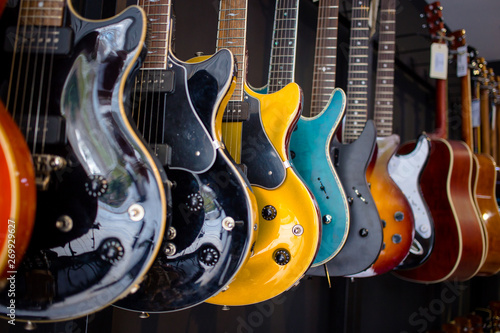 Electric guitars In a music instruments shop. Parts of guitar, guitar body