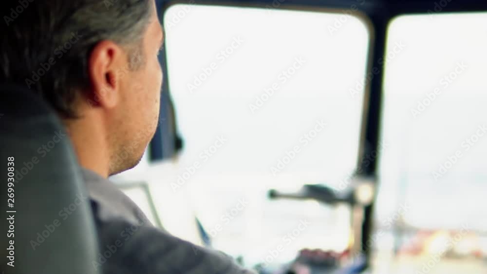 Marine navigational officer during navigational watch on Bridge . Work at sea Marine navigational officer during navigational watch on Bridge . Work at sea