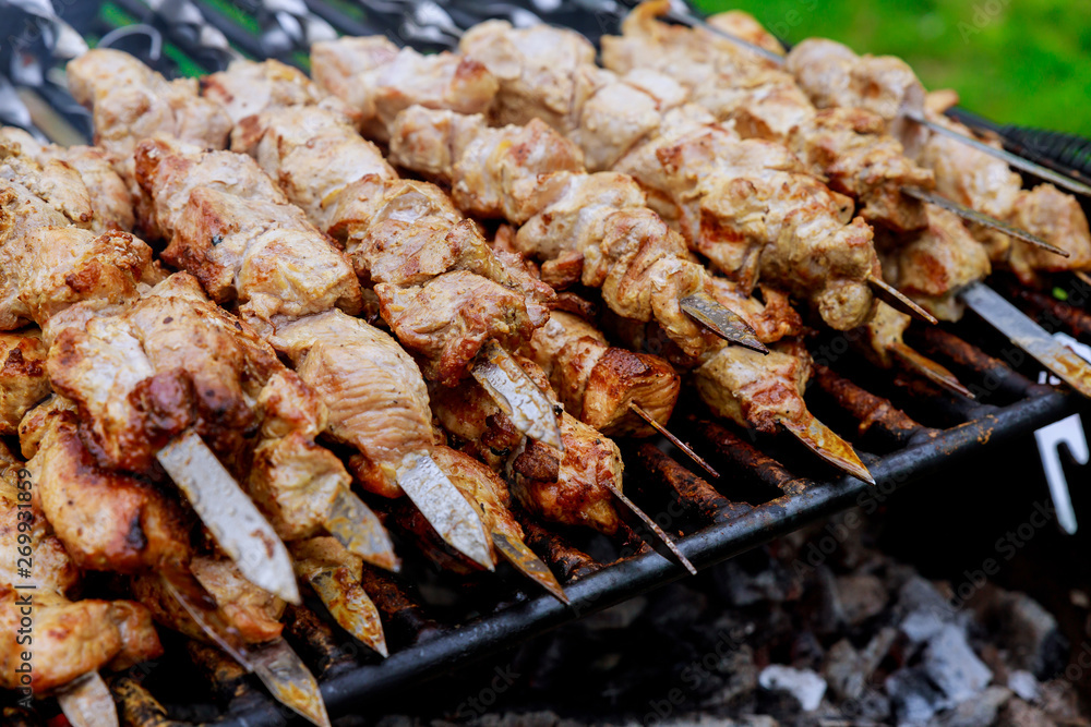 Shashlik on a barbecue grill over charcoal shish kebab popular in Eastern Europe