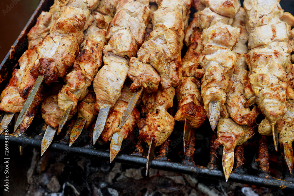 Grilled meat skewers, shish kebab on BBQ grill.
