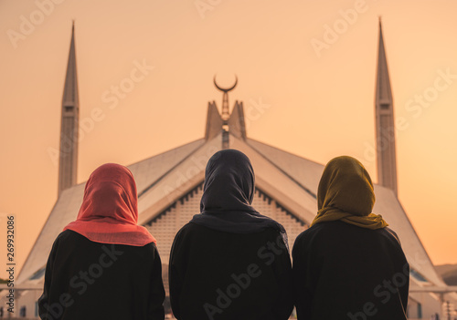 women in front of mosque
