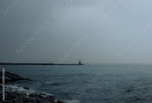 dock on lake during stormy weather