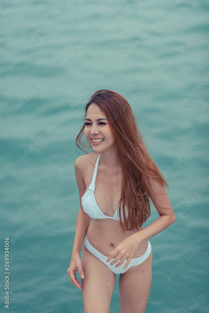 fashion outdoor summer photo of sexy girl with dark hair in luxurious bikini relaxing on yacht in the sea fashion outdoor summer photo of sexy girl with dark hair in luxurious bikini relaxing on yacht in the sea