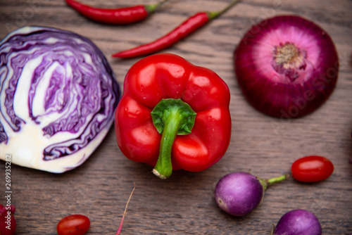 red vegetables set on woode...
