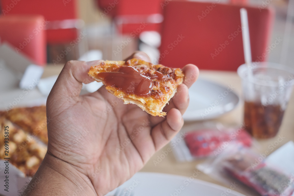 fresh and hot Pizza slice for lunch.
