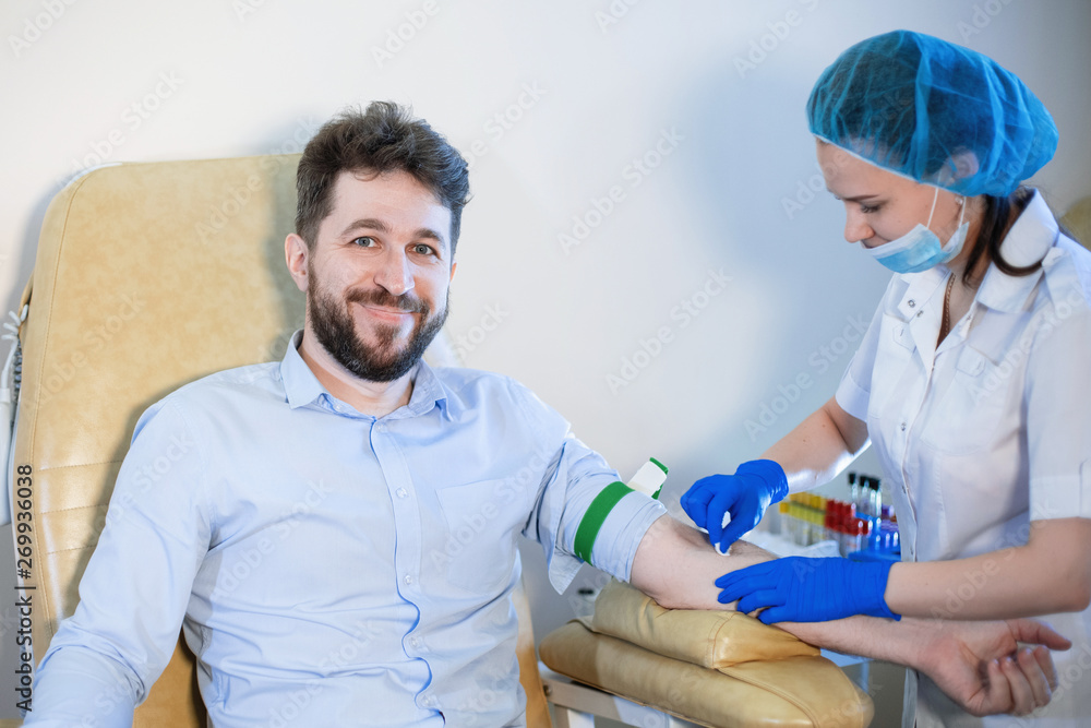 The nurse does a blood test. The nurse does a blood test.