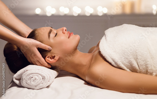 Head Massage. Woman Relaxing At Spa Salon