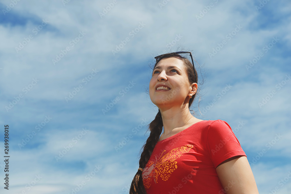 Woman looking up into the blue sky. Portrait Woman looking up into the blue sky. Portrait