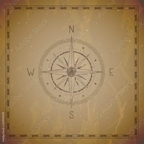 Vector illustration with a vintage compass or wind rose and frame on grunge background.