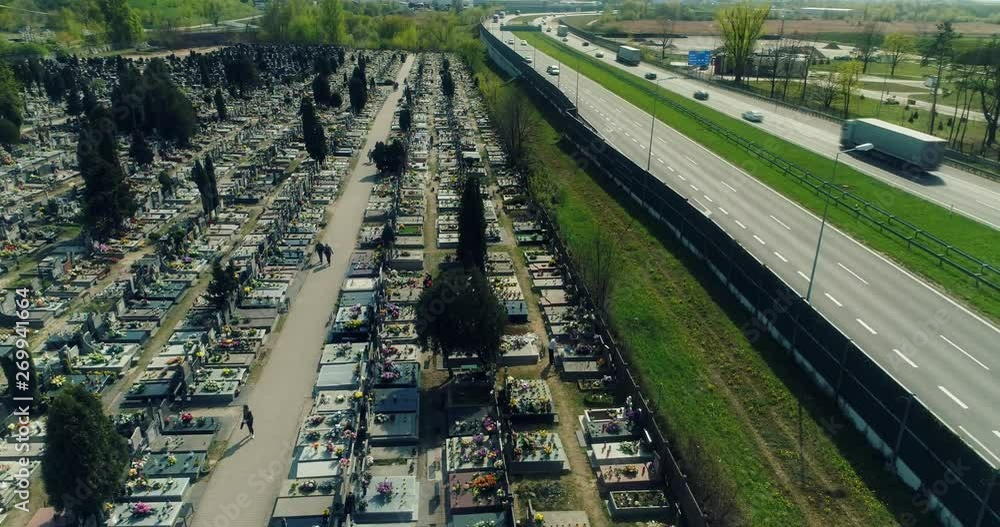 Aerial view of a cemetery neighboring to multiple lane highway. Aerial view of a cemetery neighboring to multiple lane highway.