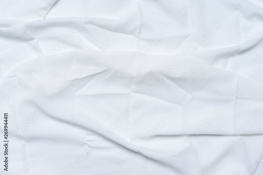White wrinkled, rippled, surface fabric texture background.
