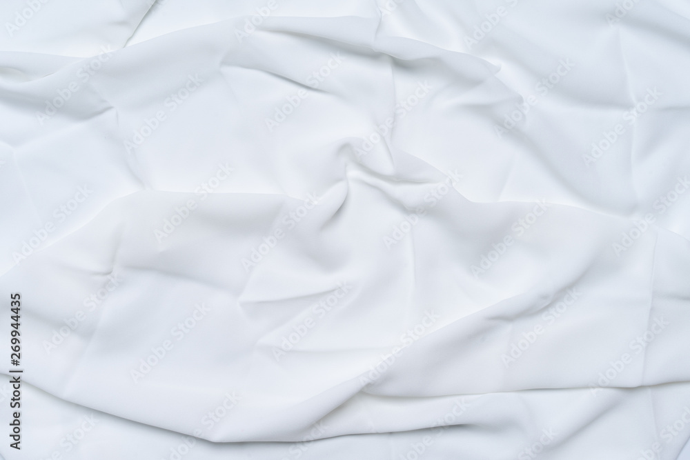 White wrinkled, rippled, surface fabric texture background. White wrinkled, rippled, surface fabric texture background.