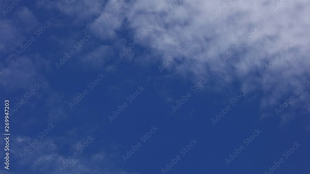 Dissipating tropical cloudscape time lapse with bright white cloud formations and deep blue skies. Static camera shot in hd. Dissipating tropical cloudscape time lapse with bright white cloud formations and deep blue skies. Static camera shot in hd.