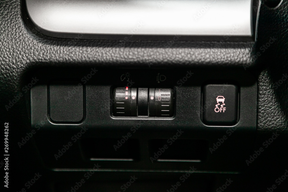 Сlose-up of the car black interior: off road and other buttons Сlose-up of the car black interior: off road and other buttons