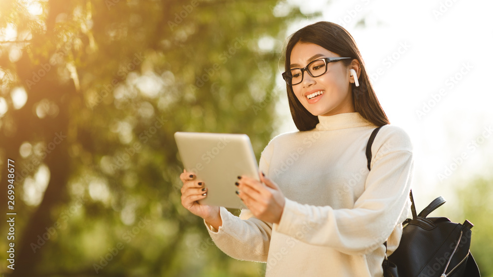 Asian Girl Using Tablet, Searching Place By Gps Asian Girl Using Tablet, Searching Place By Gps