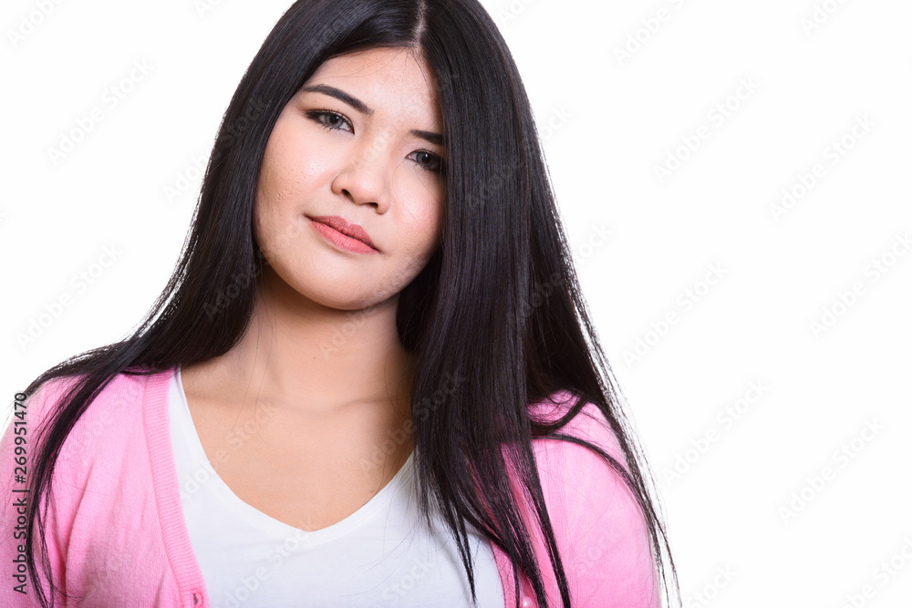 Studio Portrait Of Young Asian Woman Isolated Against White Background Studio Portrait Of Young Asian Woman Isolated Against White Background