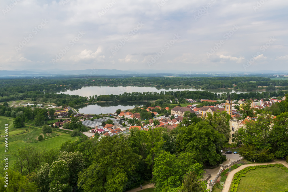 Aerial view to Hluboka nad Vltavou with pond Municky, Czech landscape