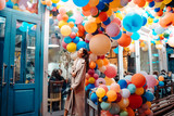 Woman on the background of wooden door with balloons