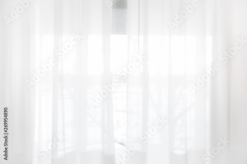 Defocused curtain window and stationery box with sunlight. © Kritchanon