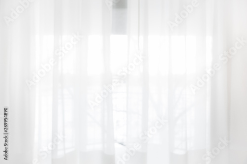Defocused curtain window and stationery box with sunlight.