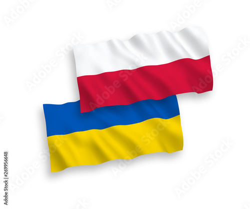 National vector fabric wave flags of Poland and Ukraine isolated on white background. 1 to 2 proportion.